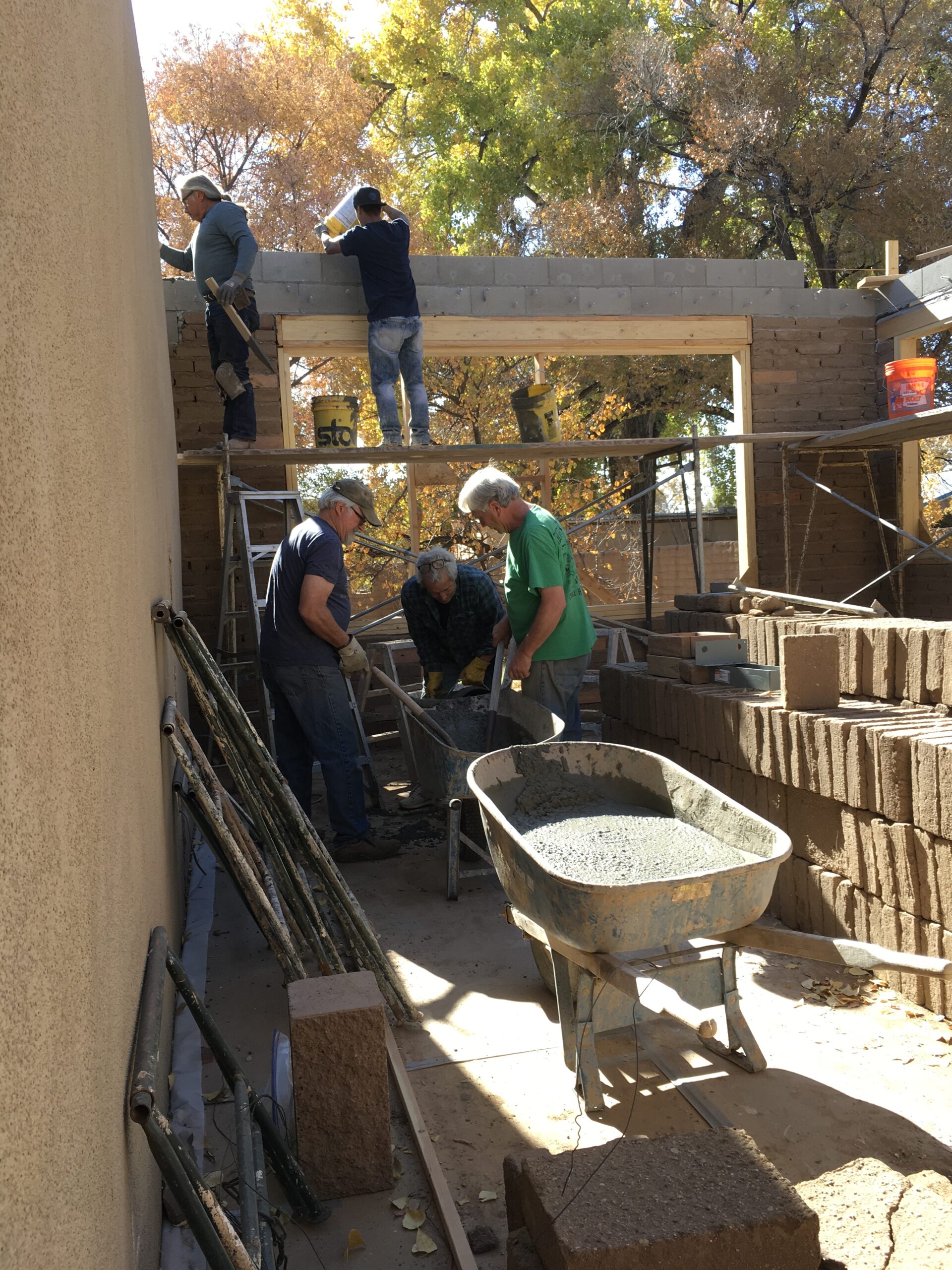 Teamwork constructing Albuquerque adobe
