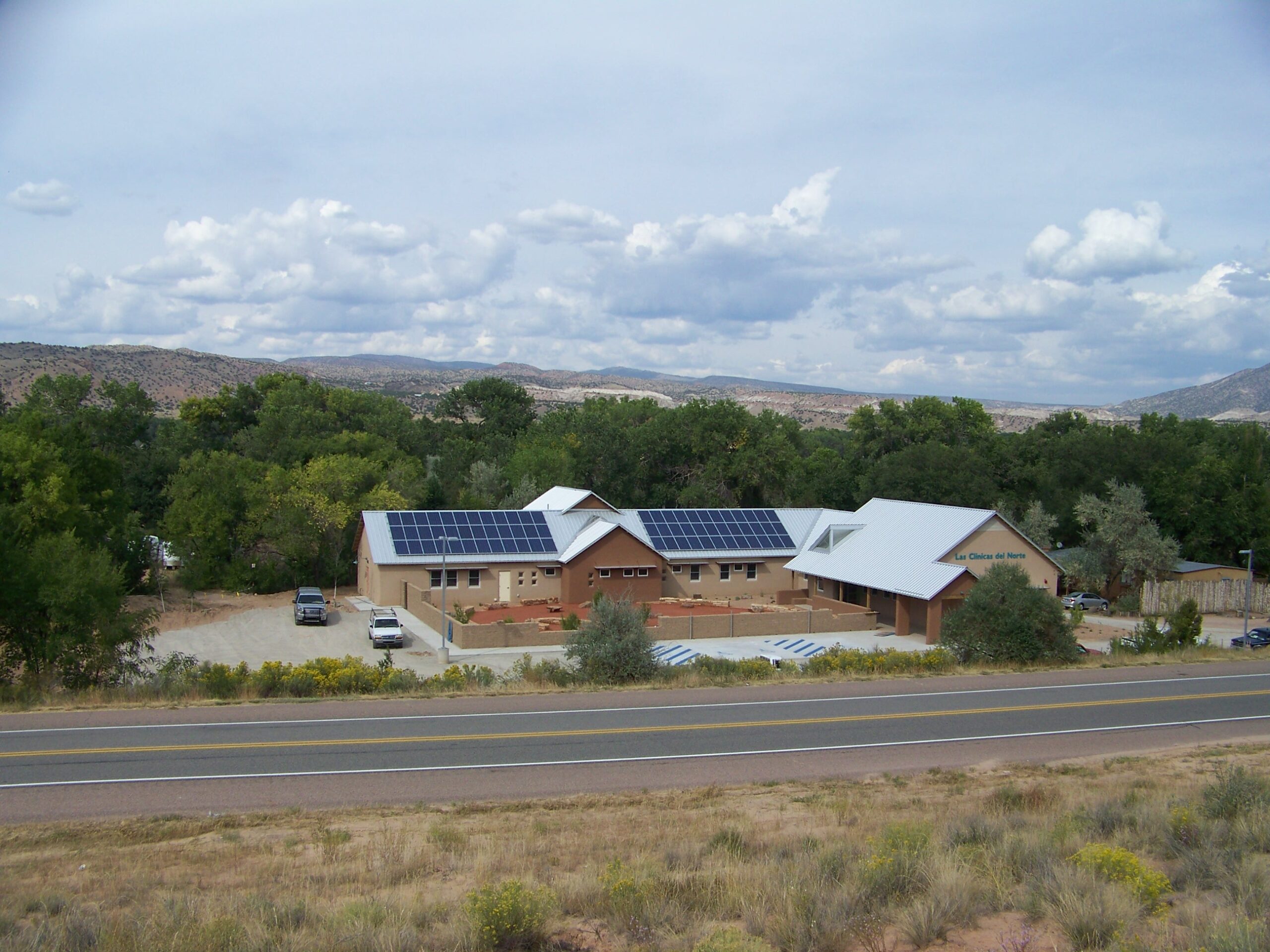Abiquiu clinic set in Northern New Mexico - solar panels and traditional forms with contemporary architecture