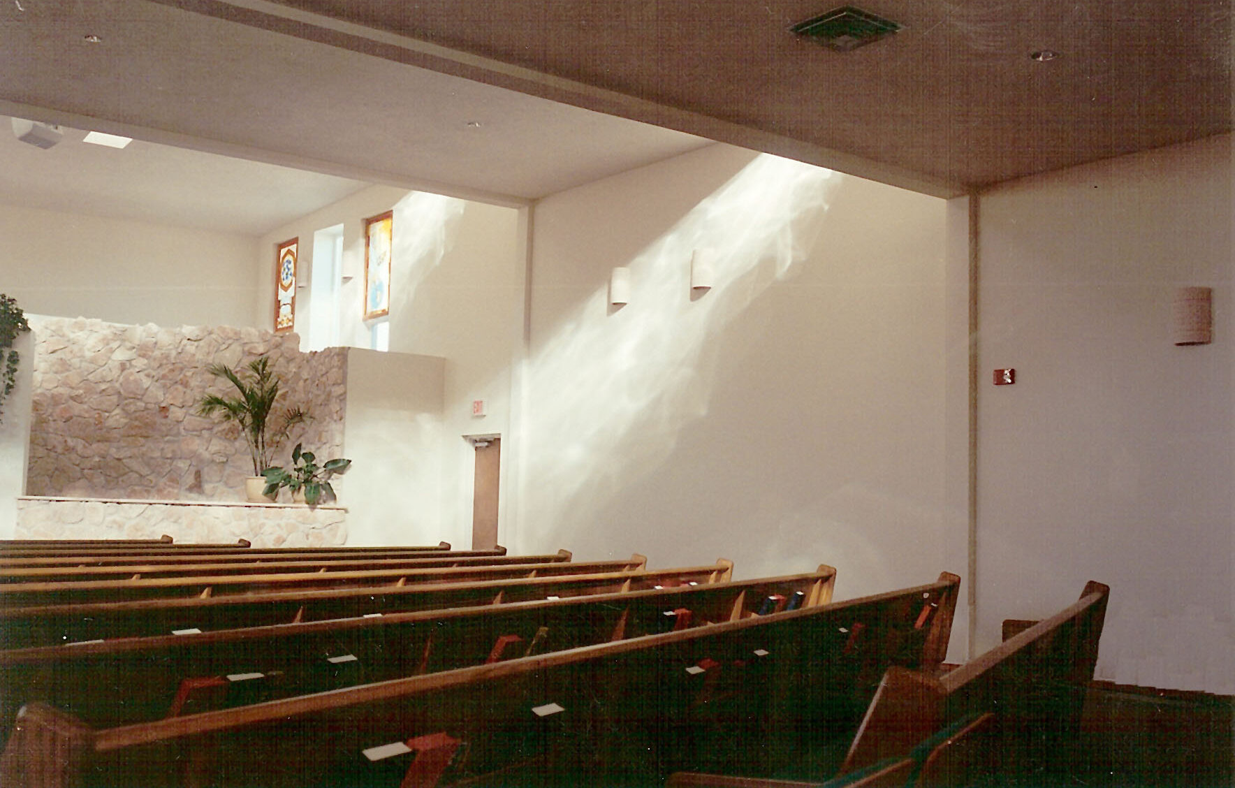 Light gently sifts down from clerestories; the pews are arranged so that churchgoers can see one another
