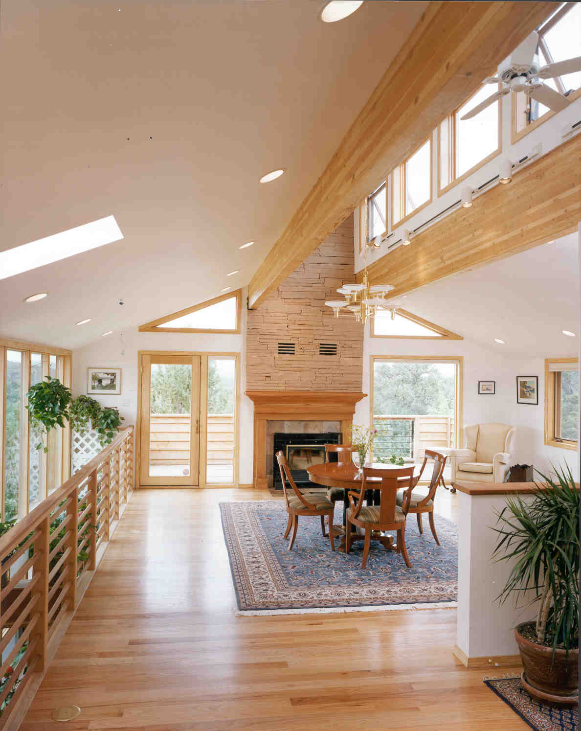 interior volume: high clerestory and planter rising from lower level; feature fireplace